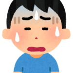 悩む人